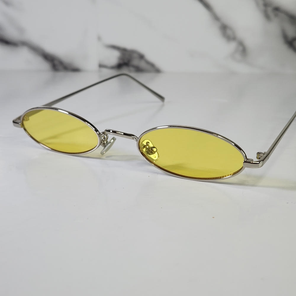 Sunglasses Oval Yellow Lenses. Silver Metal Frame. Clear Yellow Lens